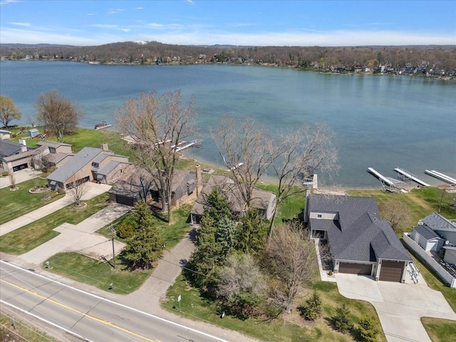 birds eye view of property featuring a residential view and a water view