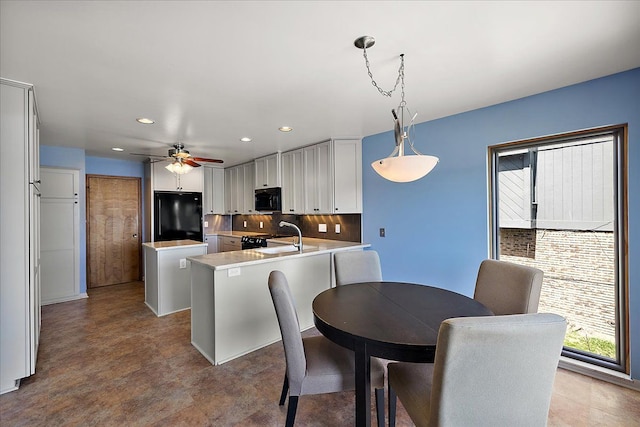 dining space with recessed lighting and a ceiling fan