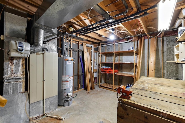 unfinished basement featuring gas water heater