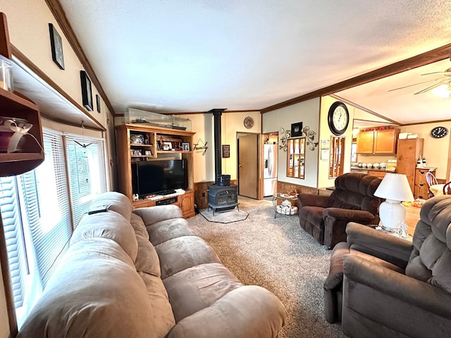13027 Norman Rd, Brockway, MI 48097 - living room featuring a wood stove, light carpet, crown molding, and a ceiling fan