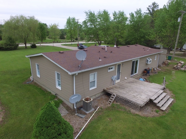 13027 Norman Rd, Brockway, MI 48097 - back of property featuring a wooden deck, roof with shingles, central AC, and a yard