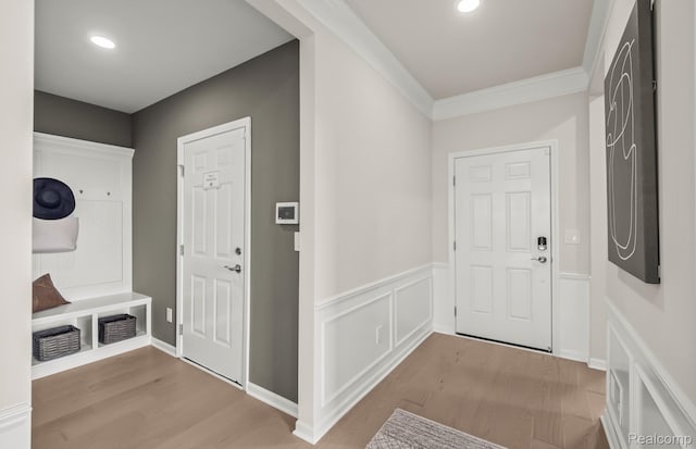 16104 Conifer Ln, Clinton Township, MI 48038 - mudroom with light wood-style floors, ornamental molding, recessed lighting, and wainscoting