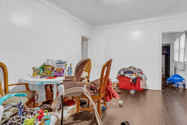 dining space with wood finished floors