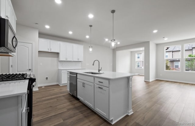 1466 Addison Cir, Walled Lake, MI 48390 - kitchen with stainless steel appliances, dark wood finished floors, white cabinets, light countertops, and recessed lighting