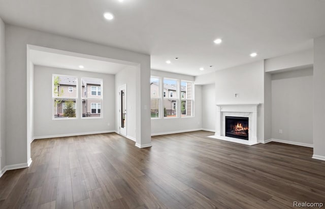 1466 Addison Cir, Walled Lake, MI 48390 - unfurnished living room with a premium fireplace, dark wood-style flooring, and recessed lighting
