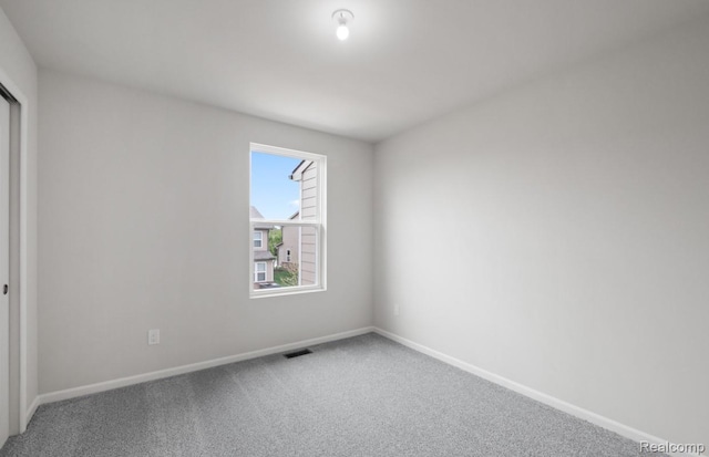 1466 Addison Cir, Walled Lake, MI 48390 - carpeted empty room with baseboards