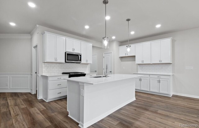 1466 Addison Cir, Walled Lake, MI 48390 - kitchen featuring stainless steel microwave, decorative backsplash, dark wood-type flooring, white cabinetry, and recessed lighting