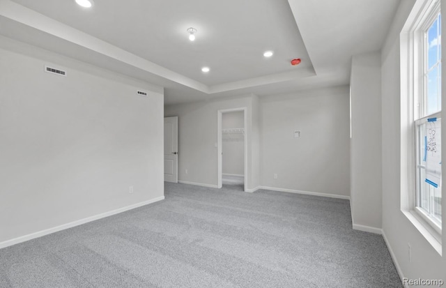 1466 Addison Cir, Walled Lake, MI 48390 - carpeted spare room with healthy amount of natural light, a raised ceiling, and recessed lighting