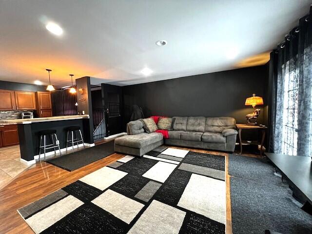 living area featuring recessed lighting and light wood-type flooring