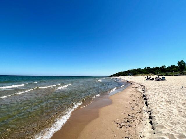 property view of water featuring a beach view