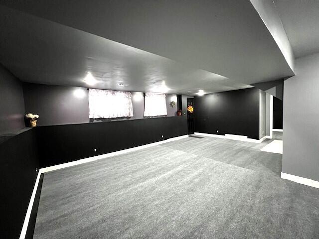 basement with baseboards and carpet floors