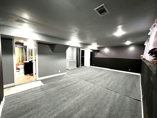 interior space with baseboards and visible vents