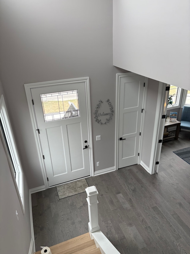 1219 N Main St, Rochester, MI 48307 - entryway featuring dark wood-style floors, a towering ceiling, and baseboards