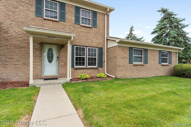 20109 Cumberland, Brownstown, MI 48183 - view of front facade with a front yard and brick siding
