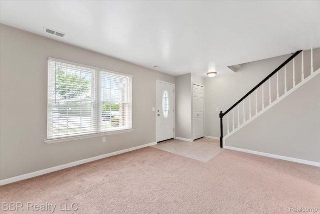 20109 Cumberland, Brownstown, MI 48183 - foyer with healthy amount of natural light, stairway, and carpet flooring