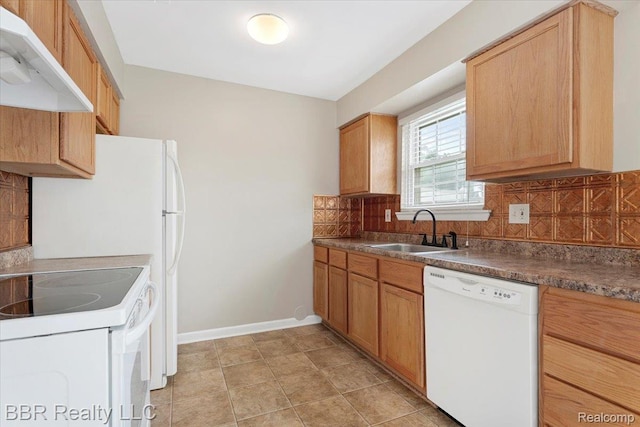 20109 Cumberland, Brownstown, MI 48183 - kitchen featuring white appliances, under cabinet range hood, tasteful backsplash, and dark countertops