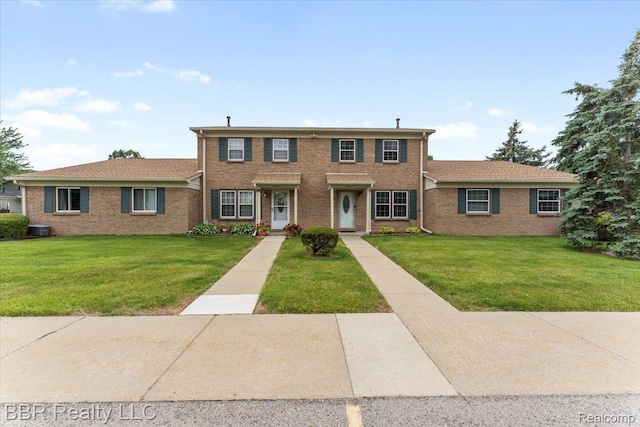 20109 Cumberland, Brownstown, MI 48183 - view of front facade featuring a front lawn and brick siding