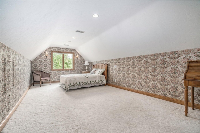 16396 M-89, Augusta, MI 49012 - bedroom with vaulted ceiling, a textured ceiling, baseboards, wallpapered walls, and carpet