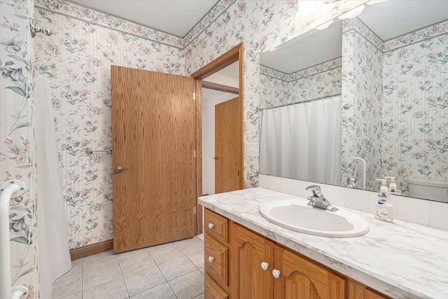 16396 M-89, Augusta, MI 49012 - bathroom featuring baseboards, wallpapered walls, tile patterned flooring, and vanity