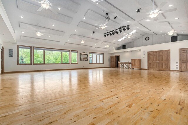 16396 M-89, Augusta, MI 49012 - interior space with high vaulted ceiling, a ceiling fan, and light wood finished floors