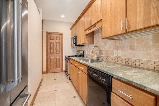 16396 M-89, Augusta, MI 49012 - kitchen featuring light stone counters, a sink, tasteful backsplash, baseboards, and black appliances