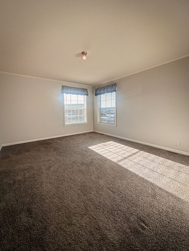 unfurnished room featuring carpet flooring, baseboards, and ornamental molding