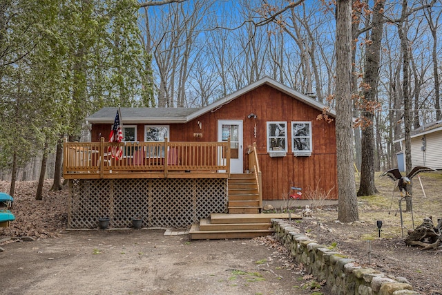 16824 Shawano Dr NE, Sand Lake, MI 49343 - chalet / cabin with a wooden deck