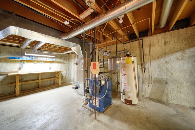 unfinished below grade area featuring gas water heater, a heating unit, and a workshop area