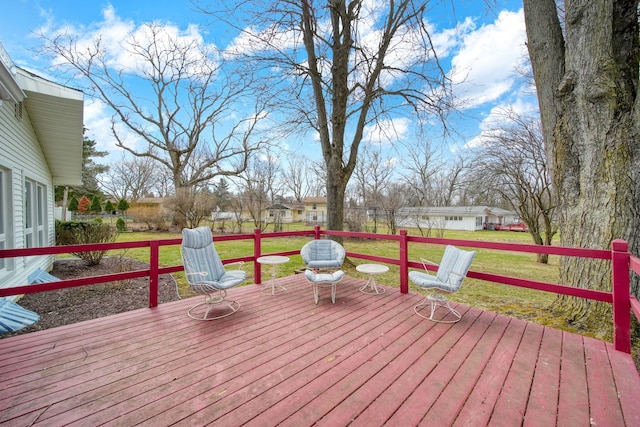 wooden terrace with a yard