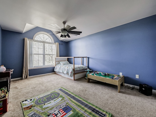 bedroom featuring carpet flooring, a ceiling fan, baseboards, and lofted ceiling