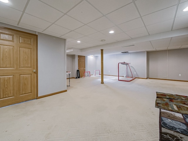 finished below grade area featuring carpet flooring, recessed lighting, baseboards, and a paneled ceiling