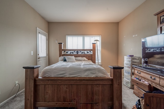 bedroom featuring carpet floors and baseboards