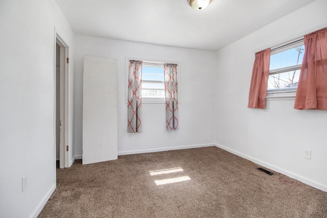 26410 Beverly Rd, Taylor, MI 48180 - carpeted empty room with baseboards