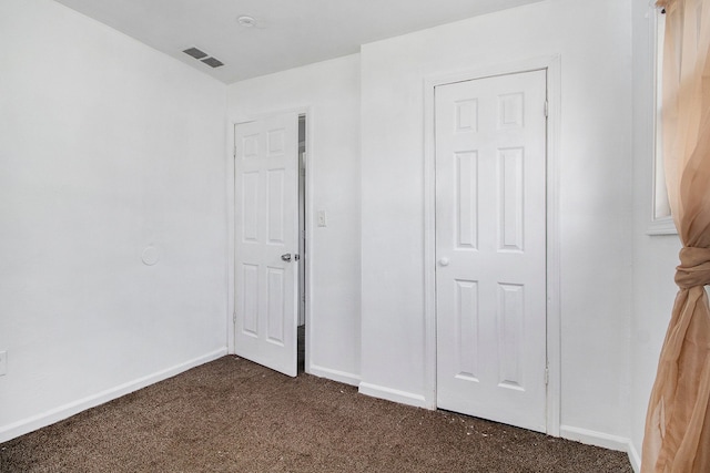 26410 Beverly Rd, Taylor, MI 48180 - unfurnished bedroom with dark colored carpet and baseboards