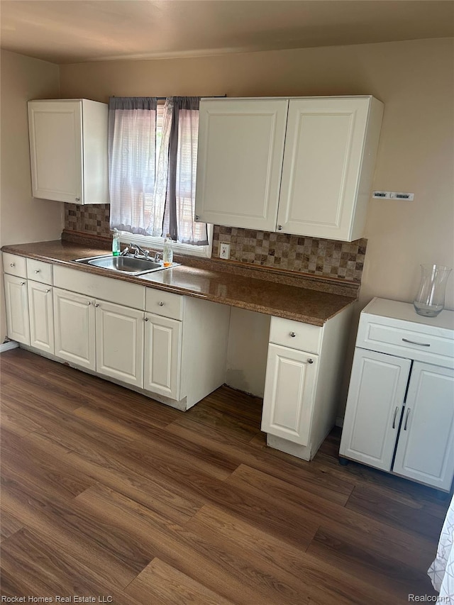 26410 Beverly Rd, Taylor, MI 48180 - kitchen featuring decorative backsplash, white cabinets, dark wood finished floors, and dark countertops