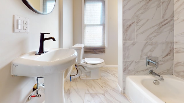 full bath with marble finish floor, a wealth of natural light, toilet, and baseboards