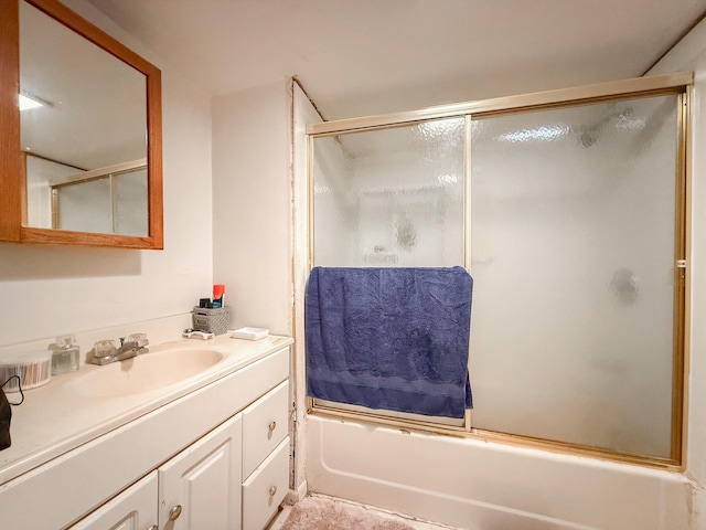 full bathroom with bath / shower combo with glass door and vanity