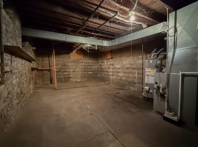 unfinished below grade area featuring gas water heater