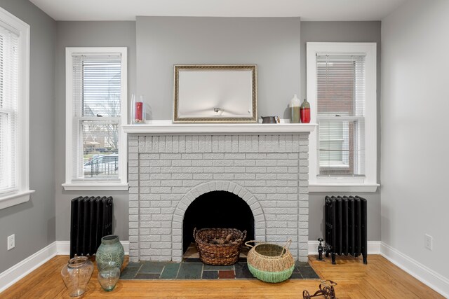 5959 Three Mile Dr, Detroit, MI 48224 - interior space featuring radiator, baseboards, and a fireplace