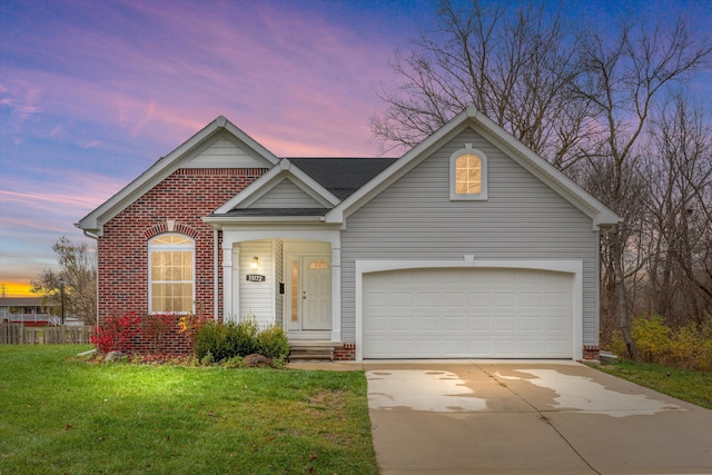 33172 Swallow Dr, Rockwood, MI 48173 - traditional home with concrete driveway, brick siding, and a yard