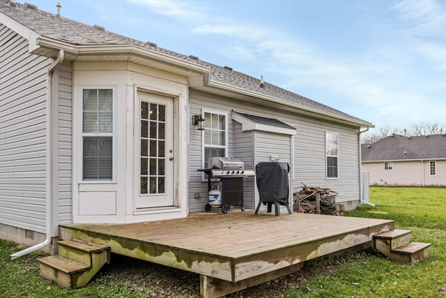 33172 Swallow Dr, Rockwood, MI 48173 - back of house with a wooden deck, a lawn, and a shingled roof