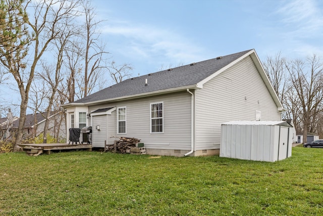 33172 Swallow Dr, Rockwood, MI 48173 - back of property with a wooden deck, a yard, and crawl space