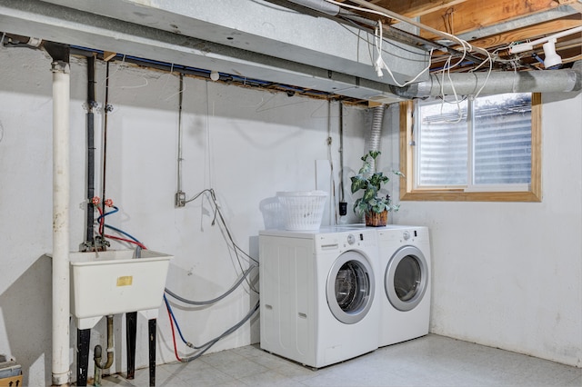 washroom featuring laundry area, separate washer and dryer, and light floors