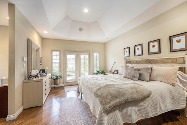 bedroom featuring recessed lighting, baseboards, access to outside, and wood finished floors