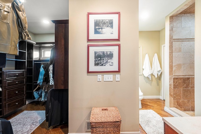 spacious closet featuring visible vents and wood finished floors