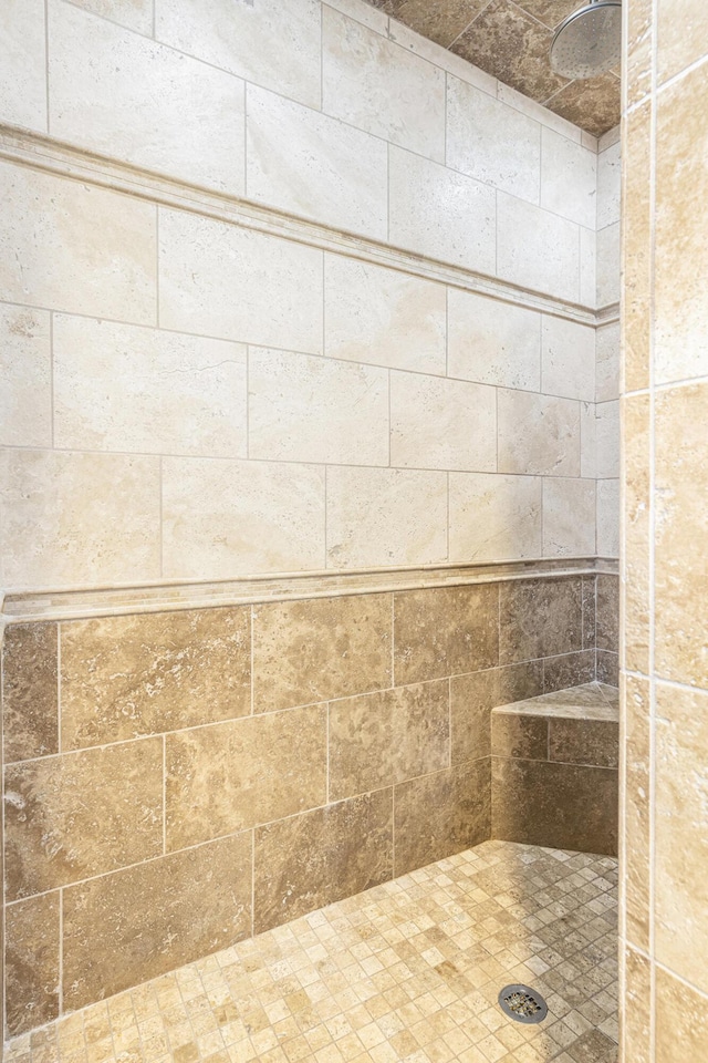 bathroom featuring tiled shower