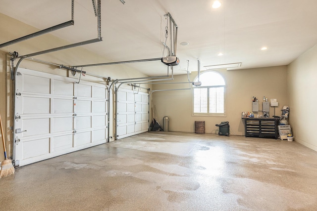 garage featuring recessed lighting and a garage door opener