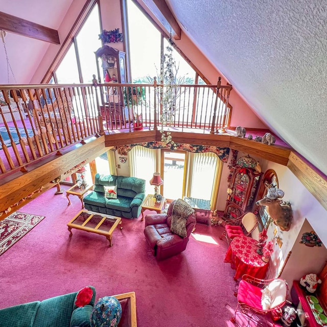 living room with high vaulted ceiling, carpet, and a textured ceiling