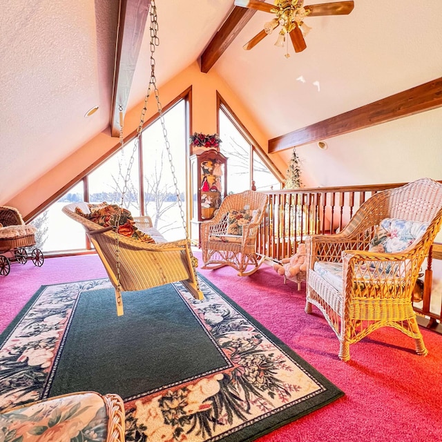sitting room featuring ceiling fan, carpet flooring, and lofted ceiling with beams