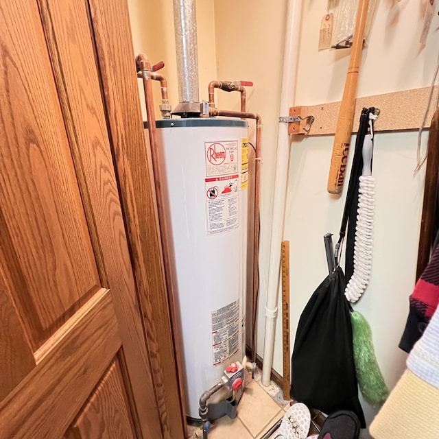 utility room featuring water heater